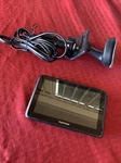 Tomtom 4CQ01 Black 5.0" Touchscreen Display Bundle W/ Mount And Charging Cables. Fixed Price $29.99.