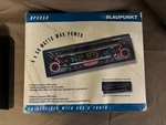 New Blaupunkt BPV650 Cd Receiver/duel Splash Guard/under Dash Housing. Fixed Price $165.00.
